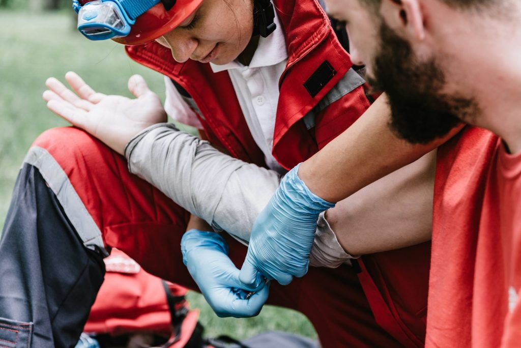 First aid paramedic in training, treating third degree burns